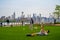 Domino park in the late afternoon with people exercising. Domino Park is a 6-acre public park in the Williamsburg neighborhood of