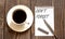 DON`T FORGET - white paper with pen and coffee on wooden background