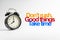 DON`T RUSH GOOD THINGS TAKE TIME inscription written and alarm clock on white background