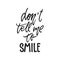 Don`t tell me to smile - hand drawn lettering phrase isolated on the black background. Fun brush ink vector illustration