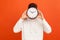 Don`t waist your time! Man in casual white sweatshirt holding wall clock hiding his face, time management, schedule and meeting