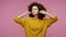 Don`t want to listen! Annoyed irritated girl afro hairstyle in hoodie covering ears and gesturing No, avoiding advice, ignoring un
