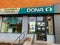 Dona pharmacy store business front on early morning hours.