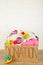 Donation box with baby clothes on light background