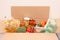 Donation box with different groceries, food donations on light background with copyspace - pasta, fresh vegatables