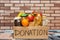 Donation box with food. Charitable donations of foodstuffs for people in need. Care and assistance concept. Copy space