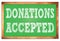 DONATIONS ACCEPTED words on green wooden frame school blackboard