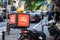 Donesi Dostava logo on a scooter on a delivery guy in Belgrade. Part of Foodpanda, Donesi is a Serbian food delivery application