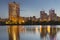 Donetsk City downtown skyline at dusk with skyscrapers illuminated over Kalmius river