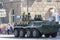 Donetsk, Donetsk People Republic, Ukraine - June 24, 2020: A column of armored personnel carriers with armed soldiers in full