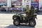 Donetsk, Donetsk People Republic, Ukraine - June 24, 2020: A military ATV with a pilot and a sniper in full gear on board moves