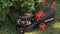 Donetsk, Ukraine - July 10, 2019: Red Lawn mower cutting grass.