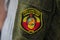 Donetsk, Ukraine - June 12, 2019: Chevron of the fighter of army of the DPR with the Soviet coat of arms