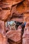 A donkey an a mule are standing next to each other in an incredible colorful rock-setting in Petra, Jordan, Middle East