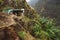 Donkey in the rundown barn nesteled into the mountainside. Rocky terrain on Santo Antao Cape Verde