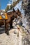 the donkeys in FirÃ¡ on the island of Santorini bring the tourists up the stairs into the town