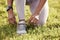 Dont allow yourself to stumble. Closeup shot of an unrecognisable woman tying her shoelaces while exercising outdoors.