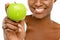 Dont call it a diet, call it a lifestyle change. Studio shot of an unrecognisable woman eating a green apple against a