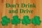 Dont Drink and drive message with green shamrocks for saint patricks day