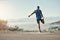 Dont ever forget to stretch before a run. Rearview shot of an unrecognizable man stretching before going for a run