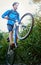 Dont limit your challenges, challenge your limits. a male cyclist riding along a mountain bike trail.