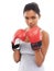 Dont mess with this girl. A gorgeous young woman wearing boxing gloves.