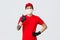 Dont worry your parcel in safe in our hands. Confident smiling asian delivery guy in red uniform, protective medical