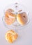 Donut, bun, cookie & glass jar on background