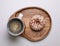 Donut and coffee on wooden plate