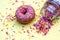 Donut donuts sprinkles on doughnuts pink yellow bright sugar strands background