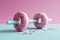 Donut dumbbell, bad fitness nutrition. Creative concept for a healthy lifestyle, sport and bodybuilding. Weight training and wrong