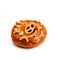 Donut glazed with caramel and pieces of pretzel, isolated on white background. Viewing forty-five degrees