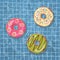 Donut lifebuoys floating in a hand drawn vector swimming pool
