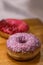 Donut With Pink Icing And Colored Sprinkles,