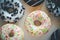 Donut with white glaze and colourful hundreds and thousands