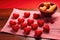 donuts arranged in the shape of a heart on a red table