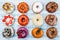 Donuts In assortment, on old wood background. Top view. Space for text