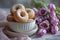 Donuts in a bowl and tulips on the table. A summer breakfast with the family