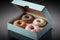 Donuts in a box. Colorful glazed doughnut in an opened carton box. AI generative