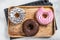 Donuts with chocolate, pink glazed and sprinkles Doughnut. White background. Top view