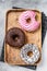 Donuts with chocolate, pink glazed and sprinkles Doughnut. White background. Top view