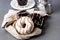 Donuts with Chocolate and Vanillas Icing on Linen Napkin on Gray Background Tasty Dinuts Morning Breakfast Coffee