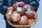 Donuts christmas,boy holding a basket of delicious donuts with powdered sugar