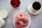 Donuts with coffee and milk. Donut with pink frosting