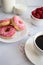 Donuts with coffee and milk. Donut with pink frosting