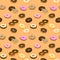 Donuts colored seamless pattern. Vector.