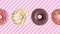 Donuts colorful animation on pink white striped background