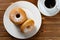 donuts with cup of coffee horizontal composition