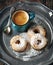 Donuts and cup of coffee. Toned image