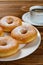 Donuts with cup of coffee vertical composition